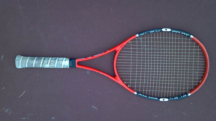 Теннисная ракетка в теннисе